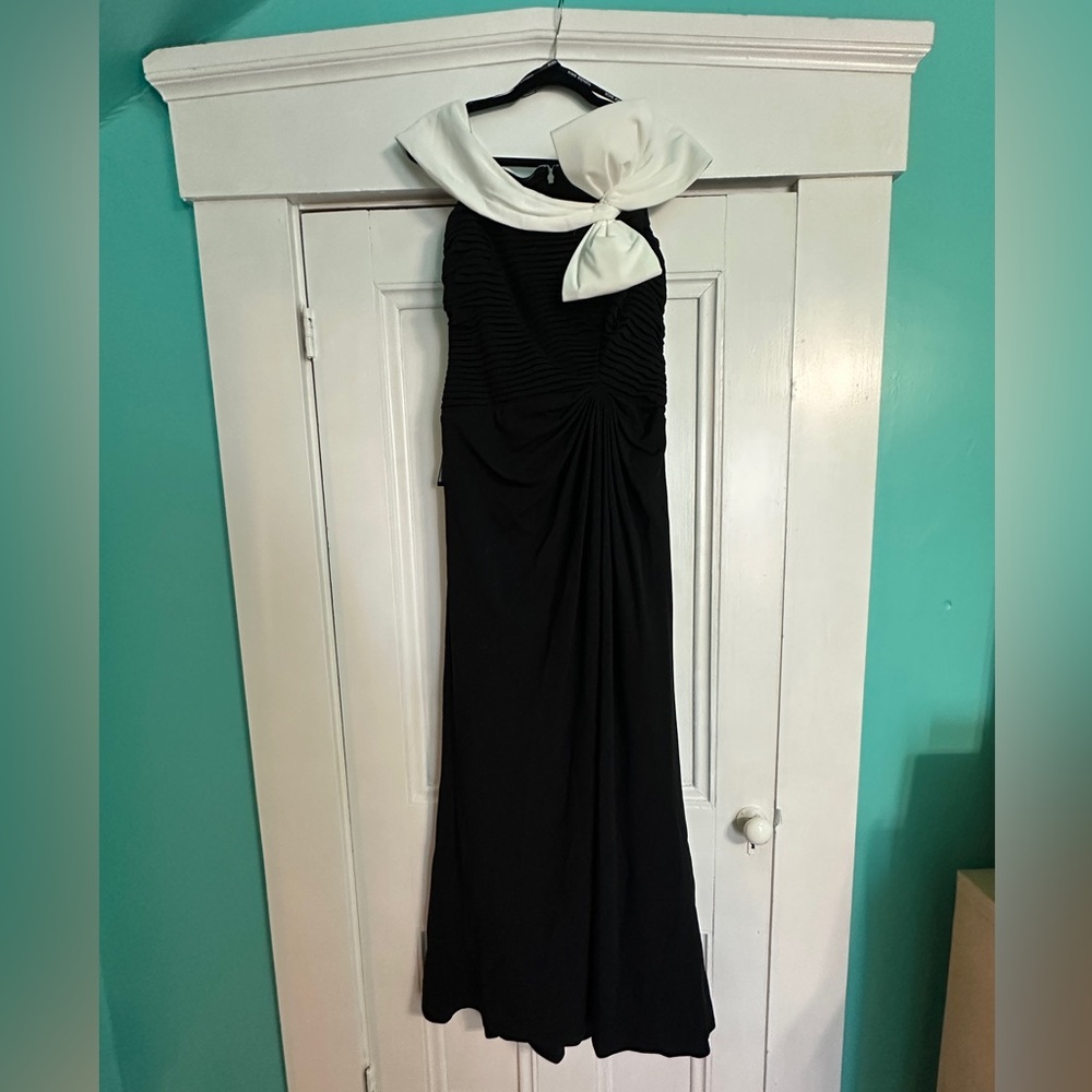 Tadashi Shoji’s crepe gown contrasting bow and thigh-high slit